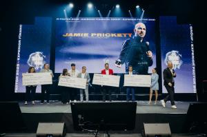 Experior Financial Group Executive Partners on stage at the Experior Factor Convention with their checks