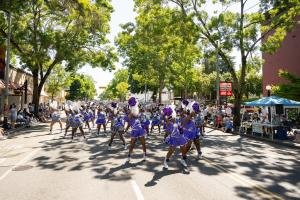 High school cheerleaders march in the 2024 Wallingford Parade