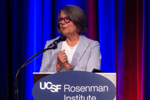 Dr. Sandra Hernández accepts the 2025 UCSF Healthcare Impact Award at the Rosenman Symposium