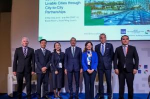 Group of people on stage at the ADB Annual Meeting in Milano