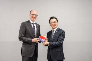 Andrew Watterson (left) are shown in a photo. Andrew Watterson, who appears to be a Caucasian man with glasses, stands on the left and is smiling. Han-Ming Chen, who appears to be an East Asian man with glasses, stands on the right and is also smiling. Th