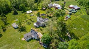 Well maintained 5 BR/3.5 BA manor home and a pristine 3 BR/2 BA guest house (currently an Airbnb) in excellent condition on 22.46± total acres with 8 outbuildings/barns/garages/sheds/milking parlor, 900'± of Po River frontage, building potential