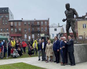 A 10-foot bronze statue of boxing legend Muhammad Ali—the largest in the world—was unveiled Saturday, May 31, in downtown Lewiston, Maine, near the site of the famous 1965 rematch between Ali and Sonny Liston City and state officials, organizers, and artists pose in front of the Muhammad Ali statue at unveiling ceremony in Lewiston, on May 31, 2025