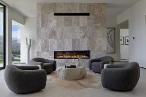 Monolithic floor-to-ceiling lineal fireplaces