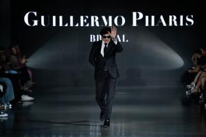 Guillermo Pharis Greets the crowd on the runway during his Spring 2026 Fashion Week Show.