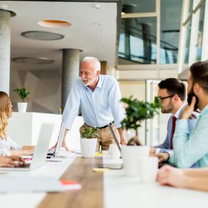 senior-boss-holds-a-meeting-for-younger-colleagues