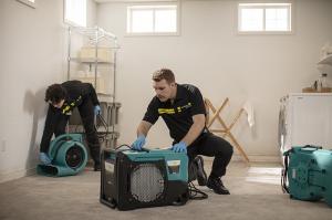 ServiceMaster Restoration By Simons, a leading disaster restoration company serving the greater Chicago area, has released a new data-driven report on water damage trends affecting local homeowners in 2025 Two ServiceMaster Simons technicians setting up air movers and dehumidifiers to dry a flooded basement in Chicago, IL.