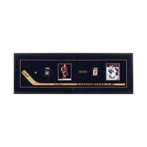 Parkhurst rookie cards for hockey stars Maurice Richard and Henri Richard, framed, alongside a Louisville Pro Flex stick signed by both brothers. Estimate: CA$4,000-$6,000.