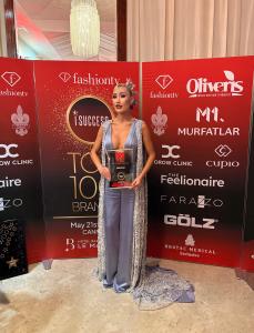 Aliia Roza wearing Tess Mann Atelier receives Top 100 Influential Coaches award at the I Success Awards ceremony. Photo used with permission ©AliiaRoza.