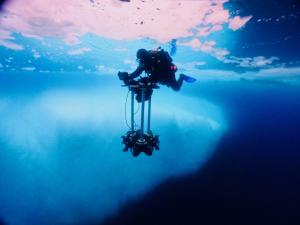 A filmmaker operates the underwater rig with nine 4k compact cinema cameras during filming for One Epic Ocean.