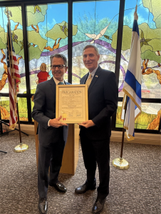 Commissioner Greg Weiss Presents Proclamation to Marc Hopin