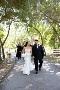 Louisiana and Yadiel strolling through the woods at Bonita Ranch, an event and wedding venue in Melbourne Florida