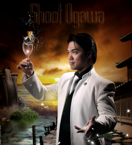 This image shows the FISM winning world champion magician Shoot Ogawa holding a glas where he just produced live goldfish from thin air at The Magical Mystery Show!