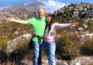 Robyn and Paul Sartorius smiling and celebrating their new life of freedom, symbolizing success, happiness, and a global entrepreneurial lifestyle