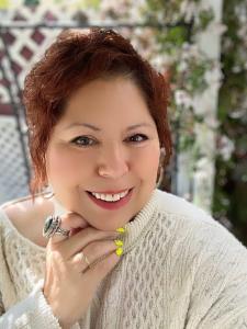 Portrait of Marie Castro Hamilton, International Best-Selling Author, Minister, and Metaphysical Practitioner featured in Whispers of the Soul: Stories of Resilience, Awakening, and the Power of Healing from Within. Captured in natural light with a soft f