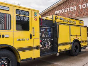 IDEX Corporation's SAM System is displayed on a yellow firetruck