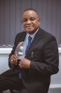 Seyi Kehinde Holding Award Trophy