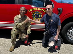 Chief Shanton Russell and Team Wolf celebrate a successful demonstration at Scott Air Force Base