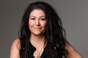 Shannon Shade, Registered Clinical Hypnotherapist in Calgary and best-selling author, seated in a calm setting, featured for her contribution to the book "Awakened Hearts."