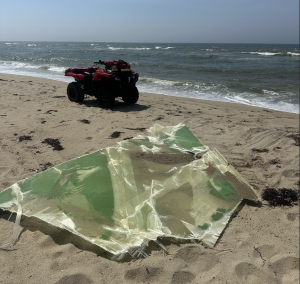 The Town and County of Nantucket (“Nantucket”) today announced a definitive settlement agreement with GE Vernova for $10 A fiberglass section of a wind turbined blade from the Vineyard Wind 1 project washes ashore in Nantucket in July 2024. Photo courtesy of Nantucket.