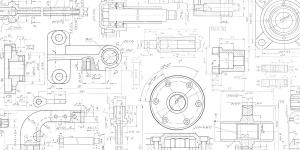 Close-up of technical mechanical drawings showing component blueprints, dimensions, and assembly schematics for manufacturing.