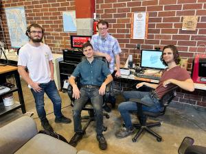 Four young men smiling, the team at WriggleBrew