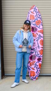 Surf Contest Winner with a Custom Surf Board designed by local community artist and Trophy