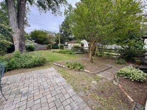 Move-in ready 3 BR/1 BA home Tudor Revival style home on .12 +/- acre lot in the Bellevue neighborhood of Richmond, VA. The home measures 1,600 +/- sf. and features an eat-in kitchen (all appliances convey), living room, dining room, utility room housing
