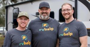 RV Help co-founders Heath Padgett (left), Dennis Lankes (center), and Josiah Mann (right), standing in front of an RV.