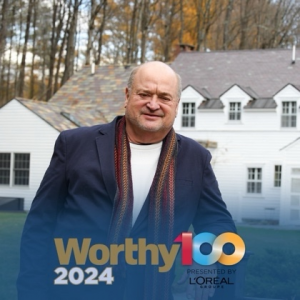 Bruce Piasecki standing after WORTH Magazine TOP 100 award