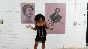 Sincerely Gaston founder Cindy Gaston stands between her 'Inner Reign' and 'Inner Voice' canvases, symbolizing the brand's mission to uplift, connect, and restore through art.