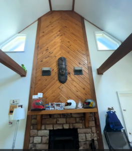 Fireplace and bobsledding helmets on display inside the future home of the William Person CTE Recovery Center