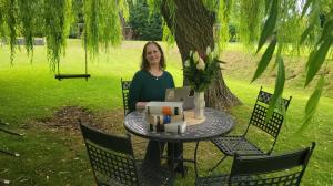 Author Nadine Theiss writing beneath the famed Rudby Hall willow tree