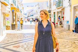Izabel Coutu relaxing in Portugal during a Prosperity Of Life branding project, illustrating the freedom and flexibility of her remote business lifestyle.