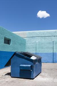 an image by Natalie Christensen of an open dumpster, wall and sky, all are in a matching blue