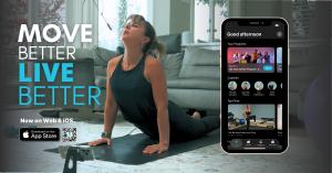 Step.co Launches iOS App Across U.S. & Canada, Offering Real Coaches, Real Skills, and Real Results 13 Woman practicing yoga at home with Step.co app open on mobile, featuring user's screen and tagline “Move Better. Live Better” with iOS download badge and QR code.