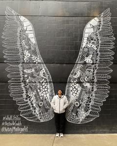 A college student poses for a photo in Nashville