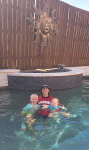 Waterview Swim CEO Ethan Chapa with two happy students from Rockwall and Wylie.