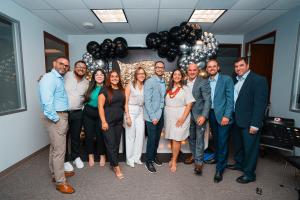 Celebrating opening of new office in San Juan.  Madison Insurance Group.