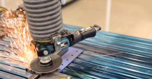 This image shows an Autobrade solution equipped with a Dynabrade end effector performing a surface finishing application.