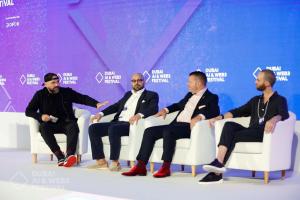 "AJ Sabbah moderating a panel at the Dubai AI & Web3 Festival, guiding a discussion with executives from Near Foundation, and the European Blockchain Association on decentralization and Web3 innovation."