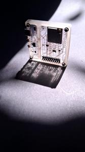 A beam of light shines down through the Transparent PCB.