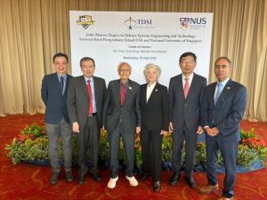 Leaders from Singapore and the Naval Postgradaute School pose for a picture at the signing ceremony, July 23.