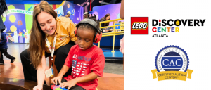 The International Board of Credentialing and Continuing Education Standards (IBCCES) proudly renews LEGO® Discovery Center Atlanta’s designation as a Certified Autism Center™ (CAC) A child engages in a hands-on LEGO activity at the LEGO Discovery Center in Atlanta, guided by a staff member.