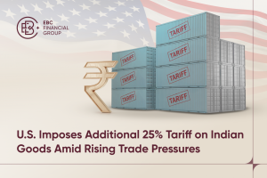 Shipping containers labelled “TARIFF” stacked beside a golden Indian Rupee symbol, with the U.S. flag in the background – EBC.