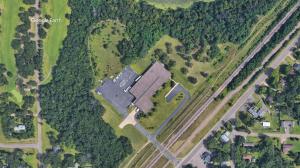 Overhead satellite view of Atlas Manufacturing’s new 48,000-square-foot facility surrounded by forest and rail access in Lake Hallie, WI.
