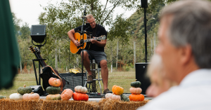 man planing guitar for audience