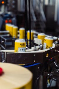 Cans of Holidaily Favorite Blonde on the production line at the brewery.
