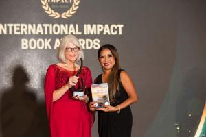 Kathy Sechrist, acclaimed author, speaker, and advocate for domestic violence survivors, has received the International Impact Book Award for her memoir Sara’s Redemption: A Journey of Courage, Resilience, and Hope Kathy Sechrist receiving her award from Nim Stant, Founder of Internatioal Impact Award