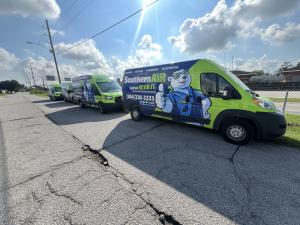 Fleet of commercial vehicles with custom wraps designed and installed by Louisiana Graphics.